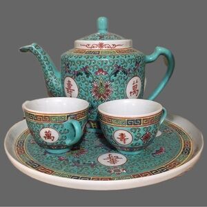 Elegant Teal Tea Set with Intricate Patterns